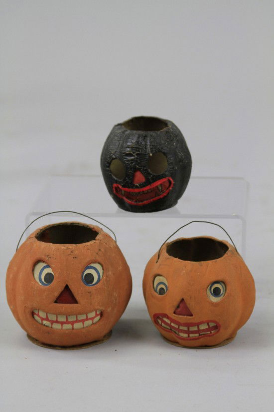 THREE SMALL JACK-O-LANTERNS: Germany, pressed cardboard, includes two paper face jack-o-lanterns and small black face jack-o-lantern, all with candle holders in them, great expressions throughout. 2 1/2" to 3" h.