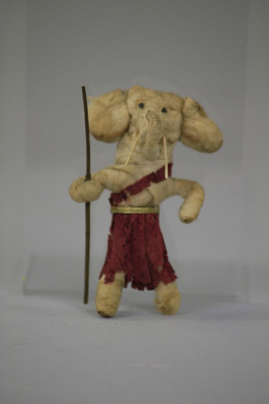 PRESSED COTTON ELEPHANT ORNAMENT: Great looking pressed cotton elephant with tusks, walking stick and crepe paper dress. 4" h.