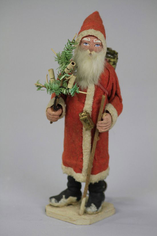 ELECTRIFIED FATHER CHRISTMAS CANDY CONTAINER: Germany, hand painted composition hands, face and boots, wears full length red robe with white trim, rabbit fur beard and face that has charming expression, holds electrified feather tree and lantern