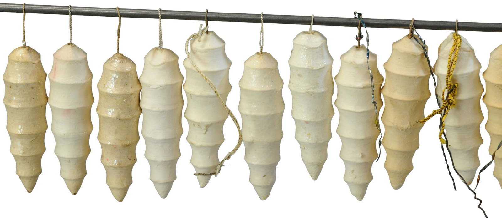 GROUPING OF COTTON ICICLES: 11. GROUPING OF COTTON ICICLES | Molded cotton. | 3" h. | (Excellent Condition) | $300 - $600