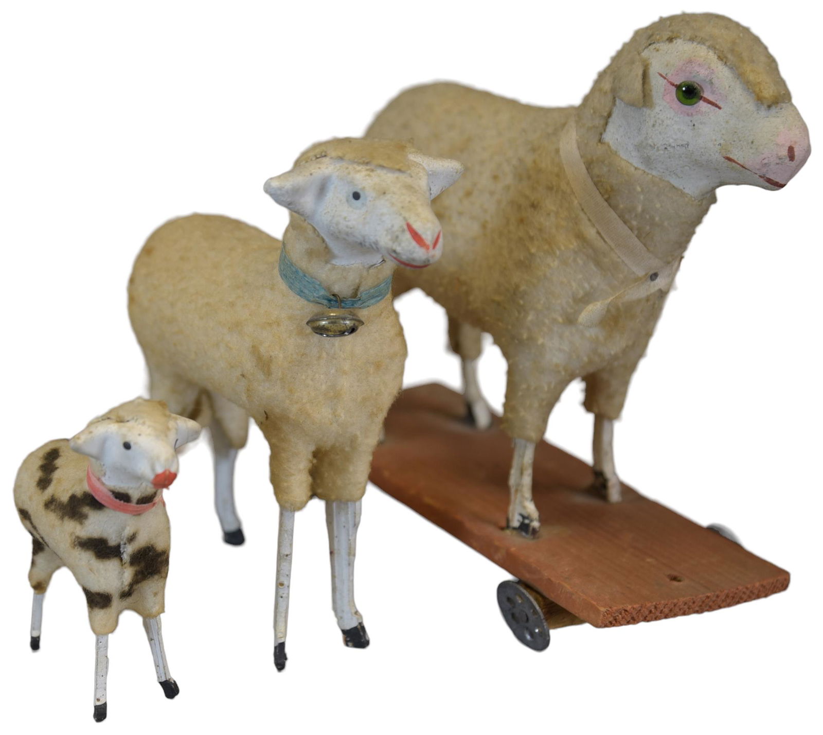 THREE GERMAN SLHEEP: 104. THREE GERMAN SLHEEP | One on wheels and one spotted. | 2.75"-5" h. | Horns missing on spotted sheep, (Excellent Condition) | $300 - $600