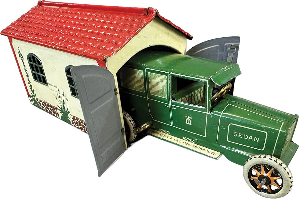 LEHMANN GARAGE WITH SEDAN: 20. LEHMANN GARAGE WITH SEDAN | Germany. Wind-up causes toy to move forward | 6" l. | Sedan missing one wheel, otherwise in (Excellent Condition) | $200 - $400