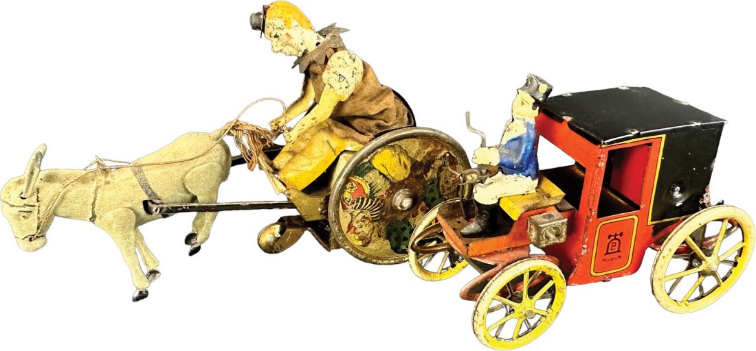 LEHMANN BALKY MULE W/ MOTOR CAR: 27. LEHMANN BALKY MULE W/ MOTOR CAR | Germany. Wind-up causes toy to roll forward | 8" l. | Motor car roof is replaced, (Excellent Condition), mule in (Very Good Condition) | $200 - $400