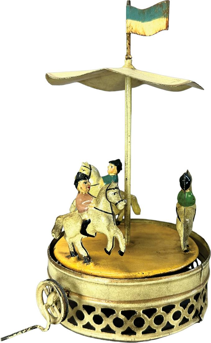 SMALL CARETTE CAROUSEL STEAM TOY: 116. SMALL CARETTE CAROUSEL STEAM TOY | Germany. Steam powered flywheel causes toy to revolve | 8.25" h. | Professionally Restored and aged. | $250 - $500