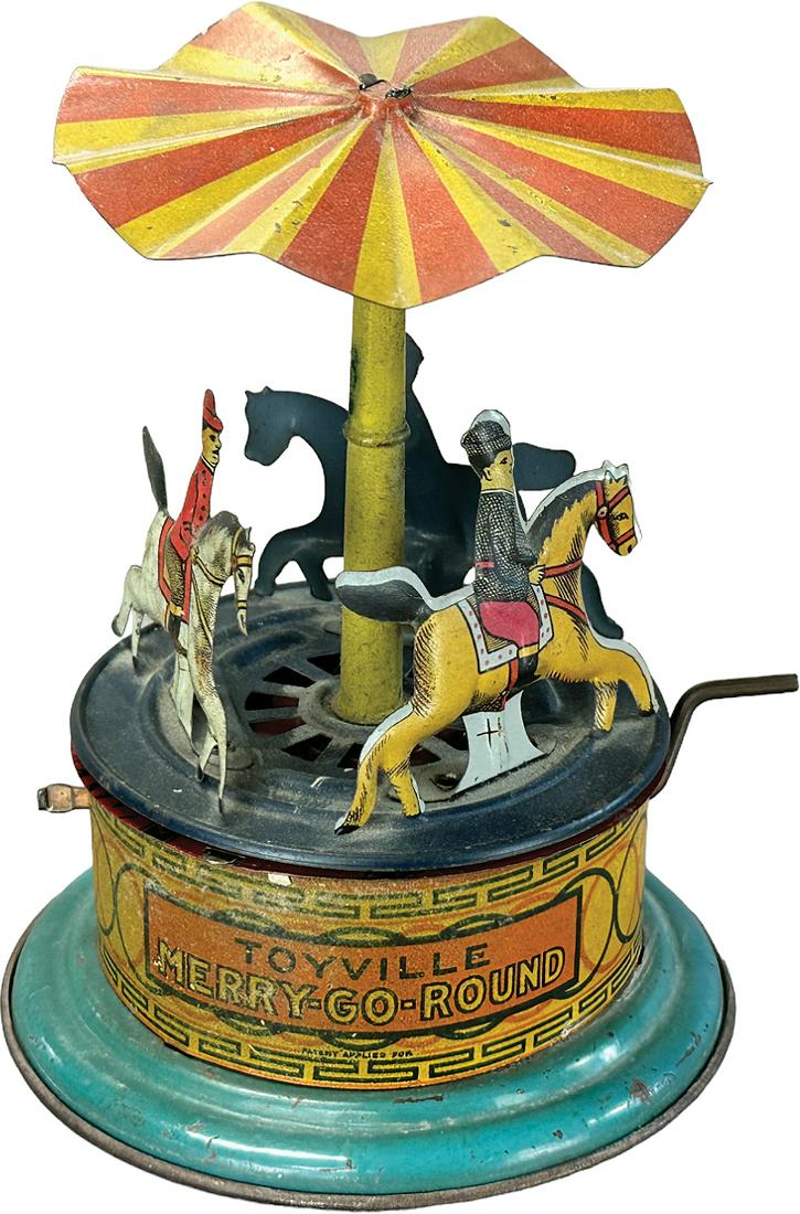 TOYVILLE HAND CRANK MERRY-GO-ROUND: 165. TOYVILLE HAND CRANK MERRY-GO-ROUND | Germany. Hand plunger causes toy to revolve | 5.25" h. | (Very Good to Excellent Condition) | $150 - $300