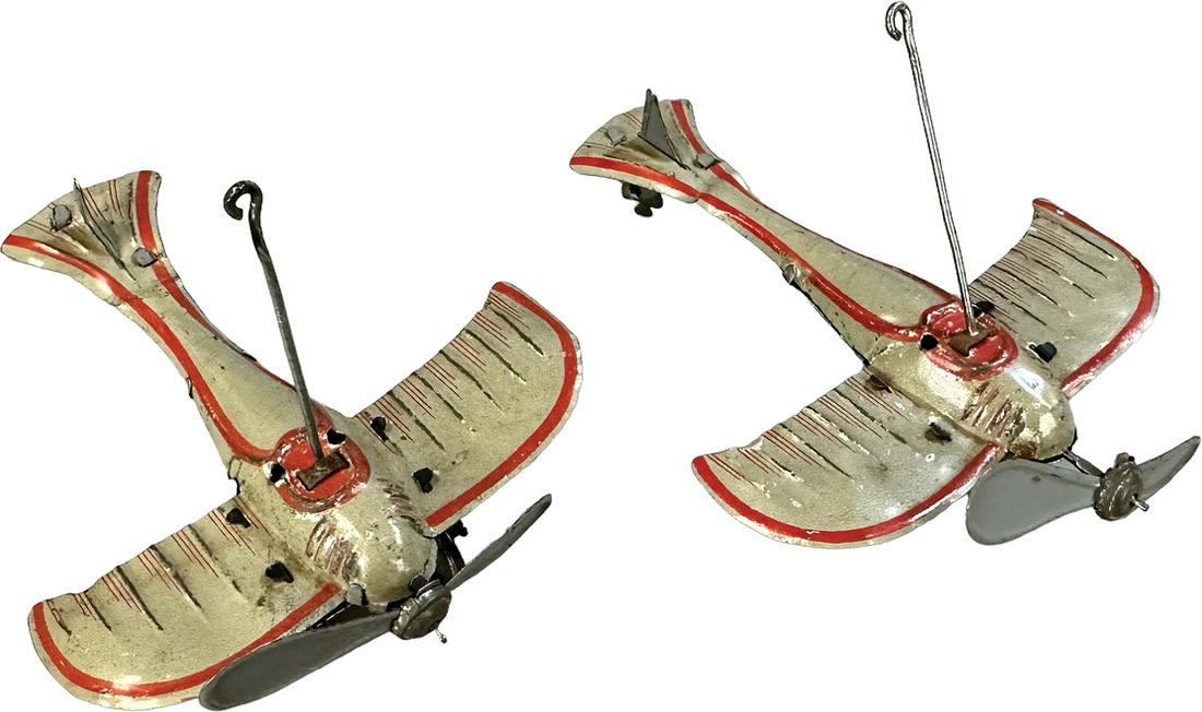 TWO GERMAN HANGING AIRPLANE PENNY TOYS: 263. TWO GERMAN HANGING AIRPLANE PENNY TOYS | Germany | 3.5" l. | (Very Good Condition) | $250 - $500