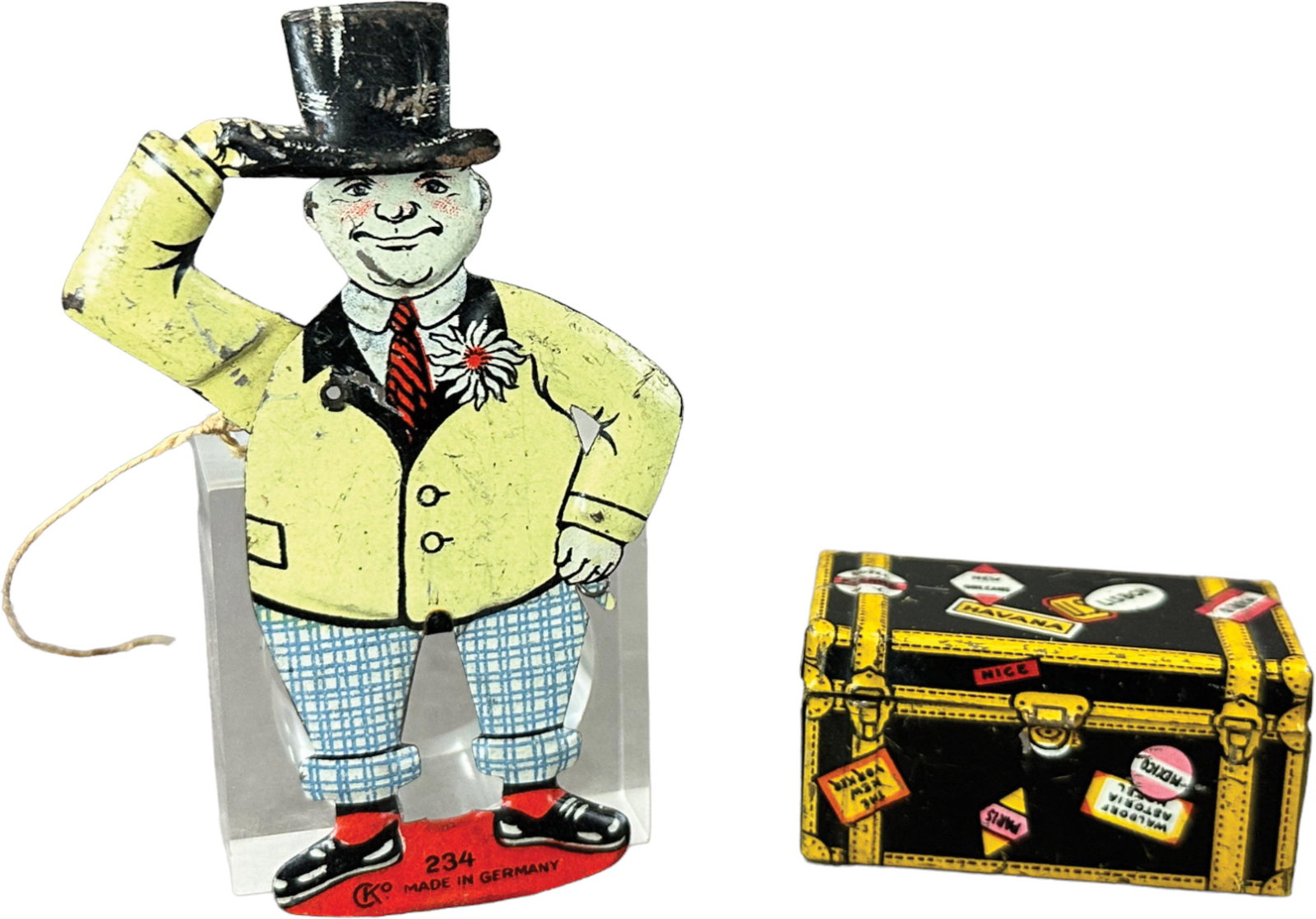 CKO MAN TIPS HAT & MARX TRUNK PENNY TOYS: 267. CKO MAN TIPS HAT & MARX TRUNK PENNY TOYS | Germany and USA. Man tips hat is a gentleman's lapel pin which has a string to pull to activate | 3.5" h. | (Excellent Condition) | $100 - $200