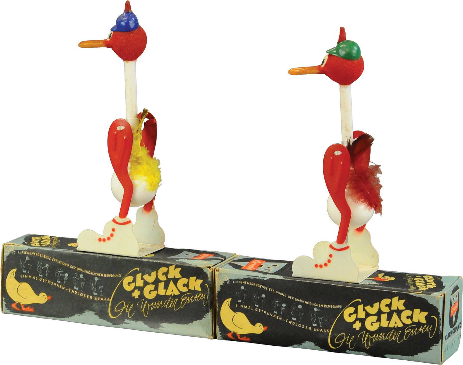 TWO BOXED ARNOLD GLUCK & GLACK TOYS: 284. TWO BOXED ARNOLD GLUCK & GLACK TOYS | Germany | 6.5" h. | All Original Condition. | $150 - $300