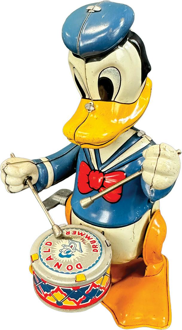 LINEMAR DONALD DUCK DRUMMER: 315. LINEMAR DONALD DUCK DRUMMER | Japan. Wind-up causes drumming in an up and down fashion | 6" h. | (Very Good to Excellent Condition) | $150 - $300