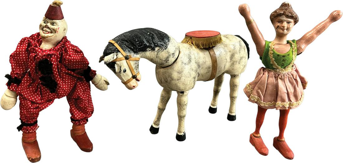 SCHOENHUT CLOWN W/ ACROBAT & HORSE: 458. SCHOENHUT CLOWN W/ ACROBAT & HORSE | USA | Horse 9" l. | Touch up to girl's face, clown redressed, tail replaced on horse, overall (Very Good Condition) | $250 - $500