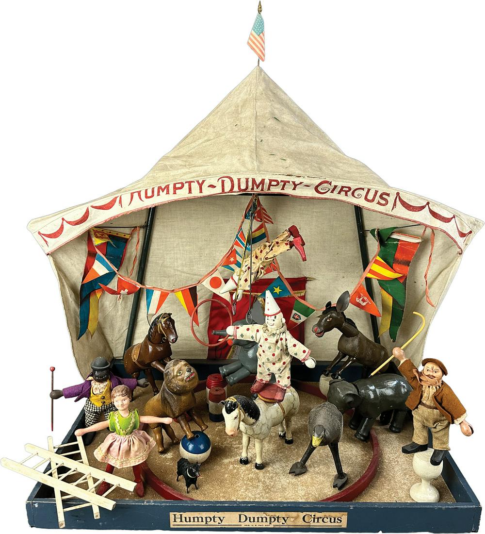 SCHOENHUT REDUCED-SIZE CIRCUS TENT DISPLAY: 469. SCHOENHUT REDUCED-SIZE CIRCUS TENT DISPLAY | USA | 12" l. | Black Dude's face is overpainted, otherwise all original set in (Excellent Condition) | $600 - $1,200