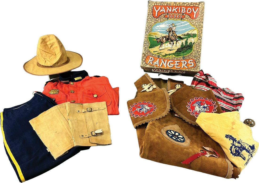 YANKITOY RODEO RANGER & MOUNTY COSTUMES: 487. YANKITOY RODEO RANGER & MOUNTY COSTUMES | Both with original boxes. | 14" l. | Mounty jacket has some staining, boot chaps have some cracking to folds, Ranger costume has a minor stain, overall i