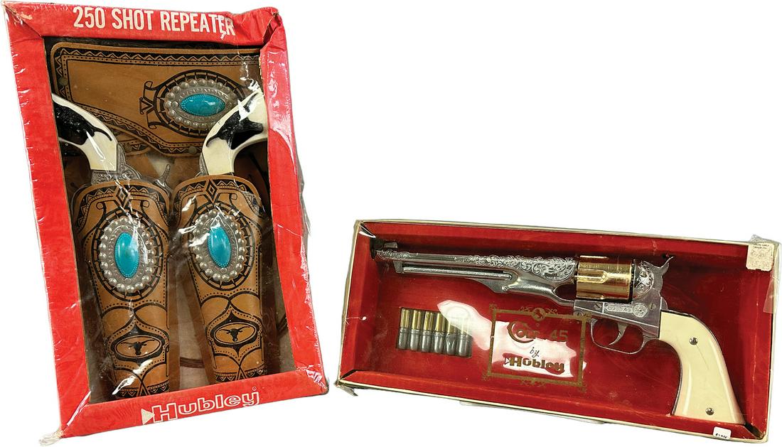 BOXED HUBLEY COLT 45 & 250 REPEATER: 490. BOXED HUBLEY COLT 45 & 250 REPEATER | 15" l. | Small crack in handle at screw of Colt, slight crushing to Hubley box corner, Old store stock in all original (Excellent Condition) | $200 - $400