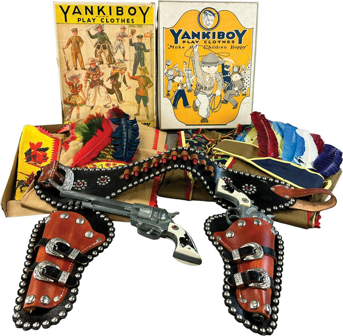 COWBOY HOLSTER SET W/ TWO INDIAN PLAY COSTUMES: 492. COWBOY HOLSTER SET W/ TWO INDIAN PLAY COSTUMES | 14" l. | Old store stock, some wear to one box, a few feathers on headdress detached but present, in All Original Condition. | $250 - $500