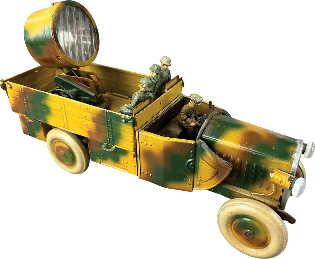 EARLY LINEOL SEARCH LIGHT TRUCK: 1023. EARLY LINEOL SEARCH LIGHT TRUCK | Germany. Wind-up Camouflage paint, tinplate wheels. | 11.5" l. | Wind-up inoperable, mismatched figures, overall in (Very Good Condition) | $250 - $500