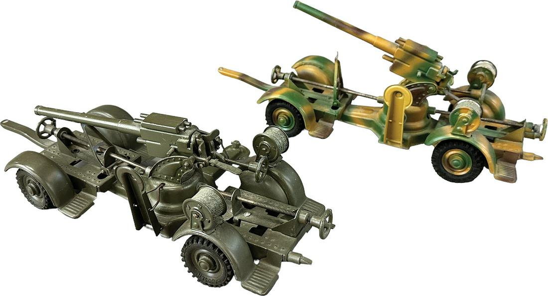 HAUSSER SMALL ANTI AIRCRAFT GUNS: 1029. HAUSSER SMALL ANTI AIRCRAFT GUNS | Germany. Two later production tin plate 88mm anti aircraft guns on mobile frames. | 10.5" l. each | (Excellent Condition) | $200 - $400