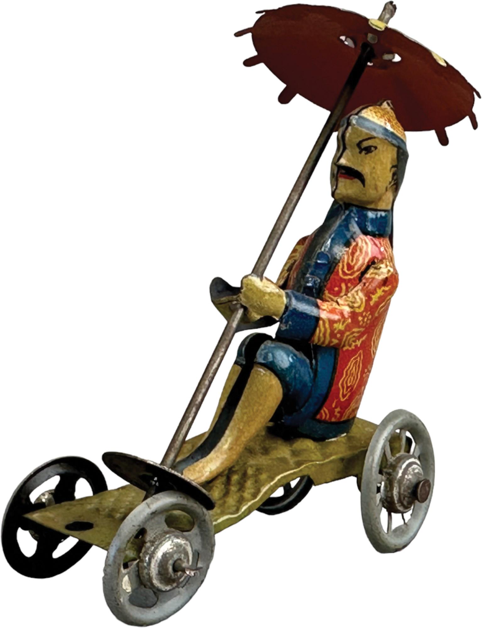 DISTLER CHINAMAN W/ PARASOL PENNY TOY: 213. DISTLER CHINAMAN W/ PARASOL PENNY TOY | Germany. | 3.5" l. | (Pristine Condition) | $300 - $400