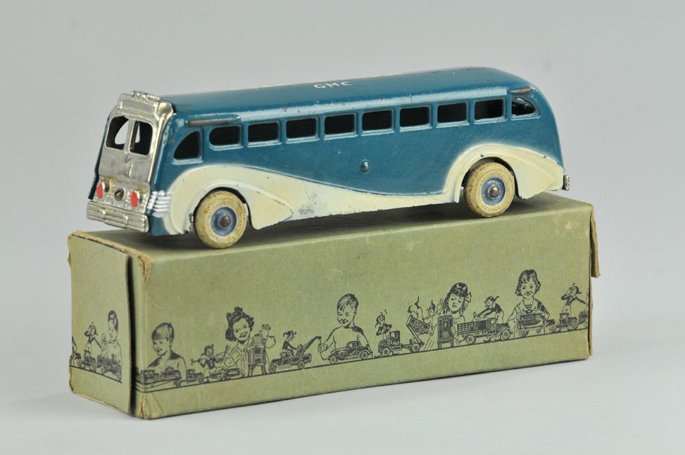 ARCADE BOXED COAST TO COAST BUS: Cast iron, painted in blue with white side highlights, roof stenciled "Coast to Coast...GMC," nickel plated front and rear grille, white rubber tires. 9" l. Box missing some end flaps, torn, (Exc. Con