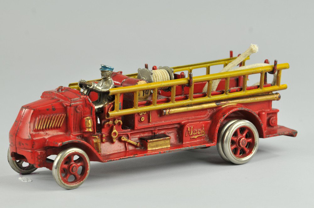ARCADE MACK CHEMICAL TRUCK: c. late 1920's, scarce model, cast iron, painted in red overall, gold trim, heavily embossed side apparatus, hose reel inside service body, side ladders on supports, nickel spoke wheels and seated dri