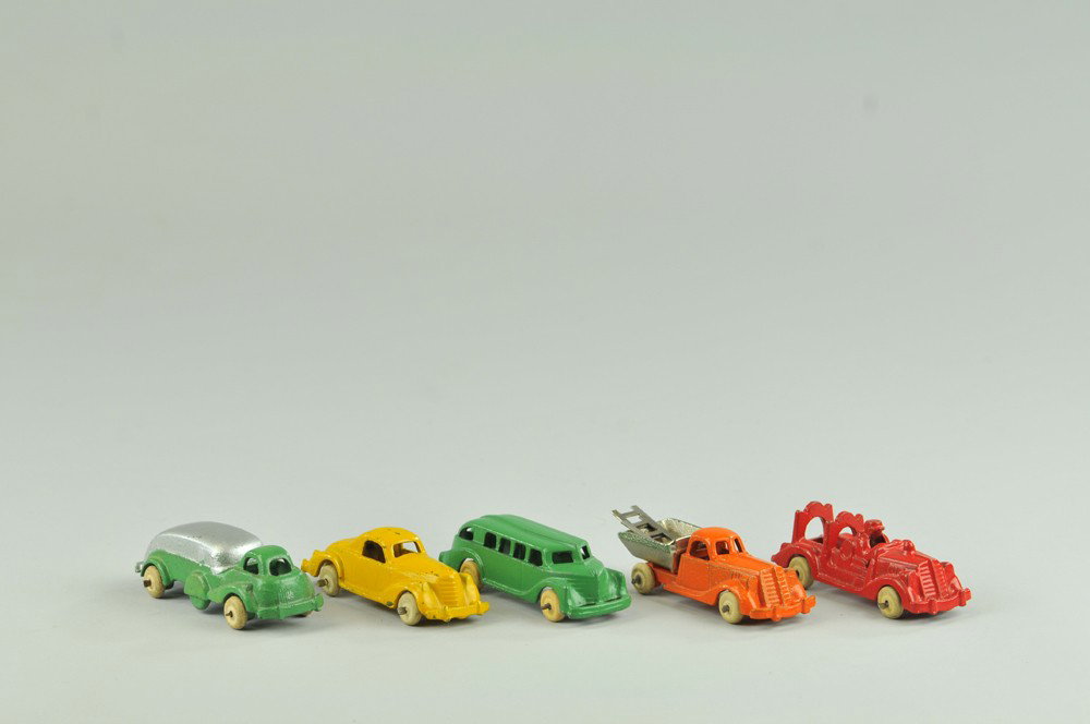 LOT OF FIVE HUBLEY VEHICLES: Cast iron, a green bus, a red ladder truck, an orange dump with nickel plated bed, a green and silver tank truck, and a yellow cab coupe, from the Hubley "Midget Line" series. 3 1/2" l. (Exc. Cond.) 3