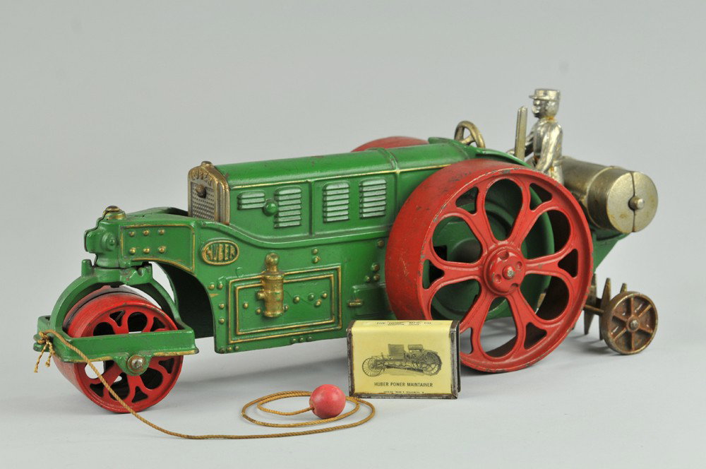 HUBLEY "HUBER" ROAD ROLLER: These were a common site on 1930's roadways in America, a very heavy casting, painted in green, large red rollers, horizontal position water tank is nickeled, figure in standing pose, rear scarifier i