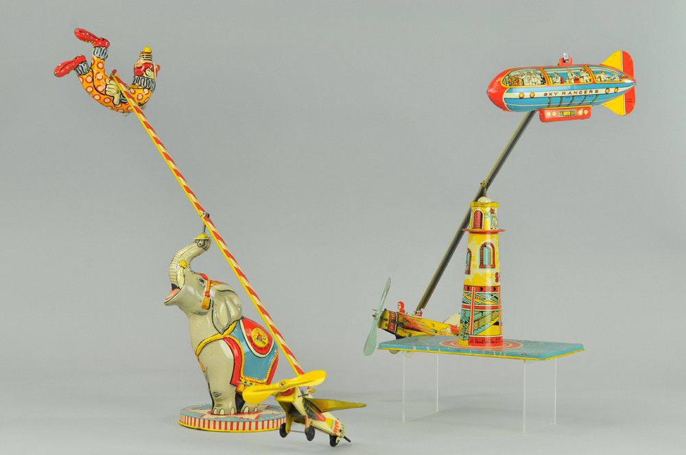 FLYING CIRCUS AND SKY RANGERS: Unique Art, lithographed tin, two very popular table toys, large scale and colorful with great aerial action. 27" l. Both (VG Cond.) Inv# 689 27" l.