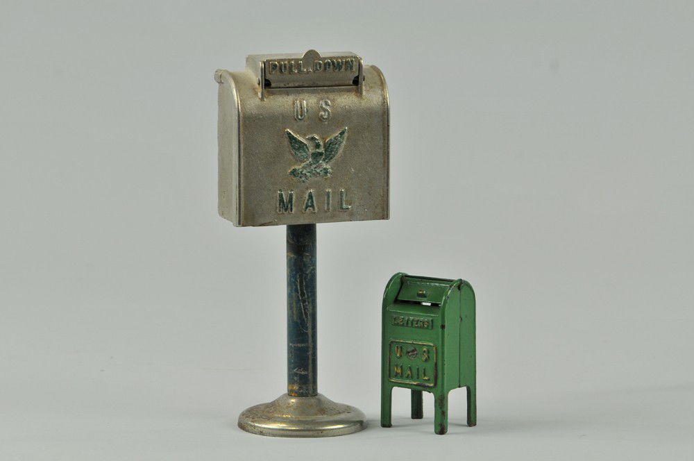 LOT OF TWO MAIL BOX STILL BANKS: Hubley, cast iron lot, smaller box painted in green, larger is nickel plated, seldom seen on this stand. 3 7/8" - 9 1/2" h. Wear to paint (VG Cond) Inv# 529 3 7/8" - 9 1/2" h.