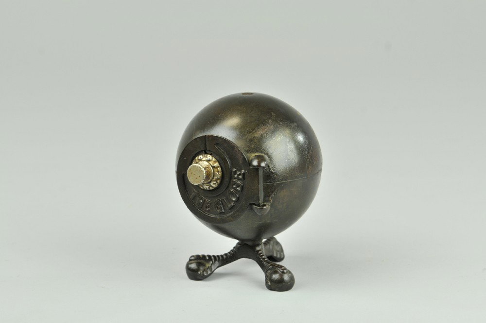 THE GLOBE STILL BANK: c. 1889, electroplated, circular door with combination front lock, claw and ball feet, embossed "The Globe," on door. 5 3/16" h. Wear to finish, (Good Cond.) 5 3/16" h.