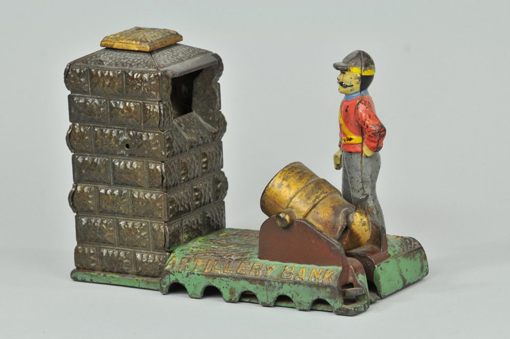 ARTILLERY MECHANICAL BANK (UNION): Shepard Hardware Co., designed by Charles G. Shepard & Peter Adams, Patent No. D-21,594 on 5/31/1892; cast iron, nickel plated, round trap. The coin is placed in the cannon (or mortor). The hammer is