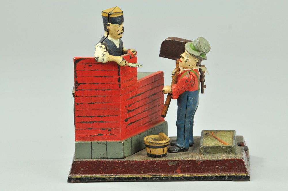 MASON MECHANICAL BANK: Shepard Hardware Co., designed by Charles G.Shepard & Peter Adams, patented 2/8/1887. The comical appearing Hod Carrier receives the coin and throws it forward, depositing it in the bank. The mason ra