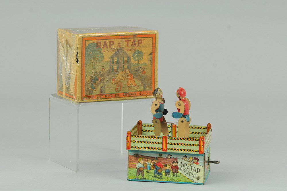 KNOCKOUT BOXERS WITH BOX: Ferdinand Strauss, litho boxing ring with wood floor and ring poles, two figures at center done in wood and supported by thin wire, billed as the Champion Prizefighters, key wind operated. 7 3/4" h. B