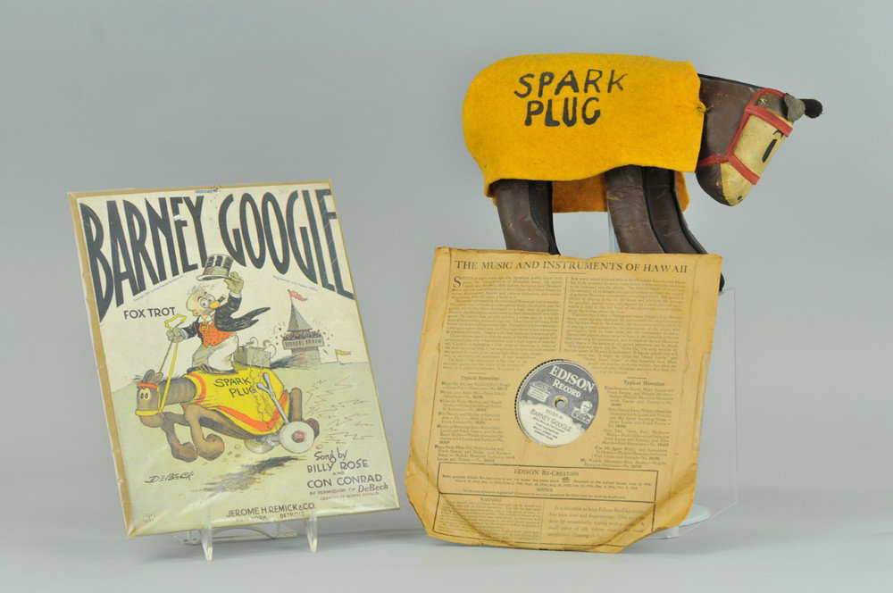 BARNEY GOOGLE RECORD AND SPARK PLUG STUFFED DOLL: Includes Edison Record by Billy Jones and Ernest Hare called "Barney Google," song sheet and stuffed Spark Plug doll with removable felt blanket. Doll 12" l. Wear to doll cover, loss to record sleeve,