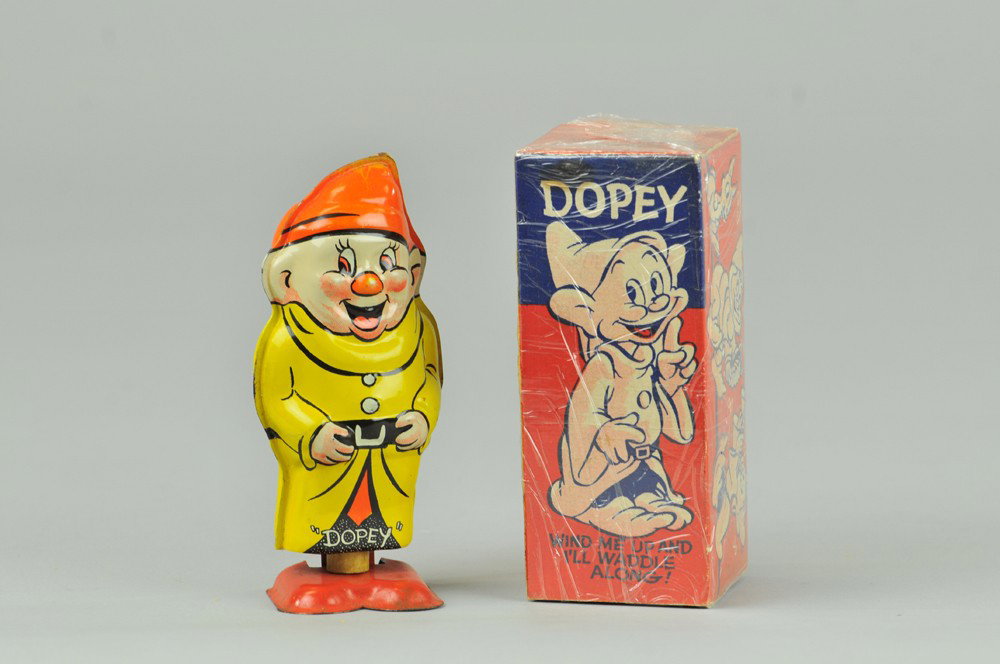 TIN WINDUP DOPEY WALKER: Made in the UK by Wells Brimtoy. Some slight discoloration to tip of hat and toe of right foot. 6" h Overall, (Exc. Cond.) 6" h