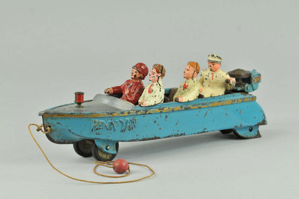 HUBLEY "PENN YAN" SPEEDBOAT: c. 1938, very impressive scale and mold details, this cast iron boat features seated passengers and motor tender at Johnson Seahorse outboard throttle, painted in blue overall with gold striping, this
