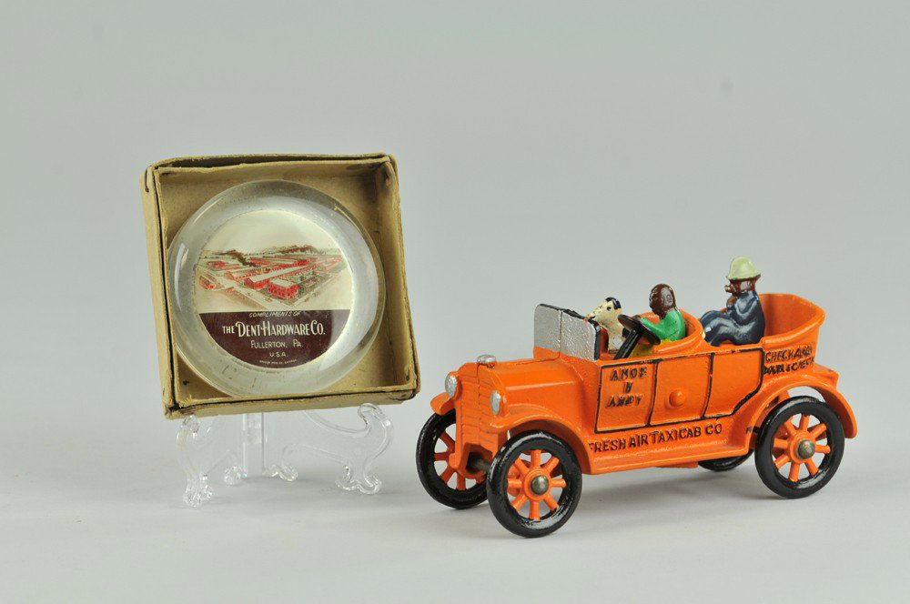 DENT AMOS 'N ANDY TAXICAB & PAPERWEIGHT: Cast iron, classic later casting of famous Fresh Air Taxi seated figures and dog, colorfully painted overall, great rendition of earlier tin toy, together with Dent factory paper weight. 6" l. (Near M