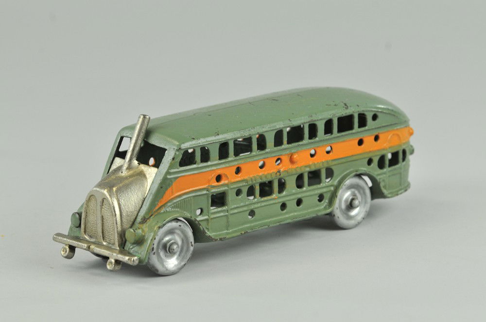 KENTON "PICKWICK NITE COACH": Kenton, cast iron, painted in green red side stripe, embossed along sides well cast with windows, disc wheels painted silver and green. 9" l. Repainted. 9" l.