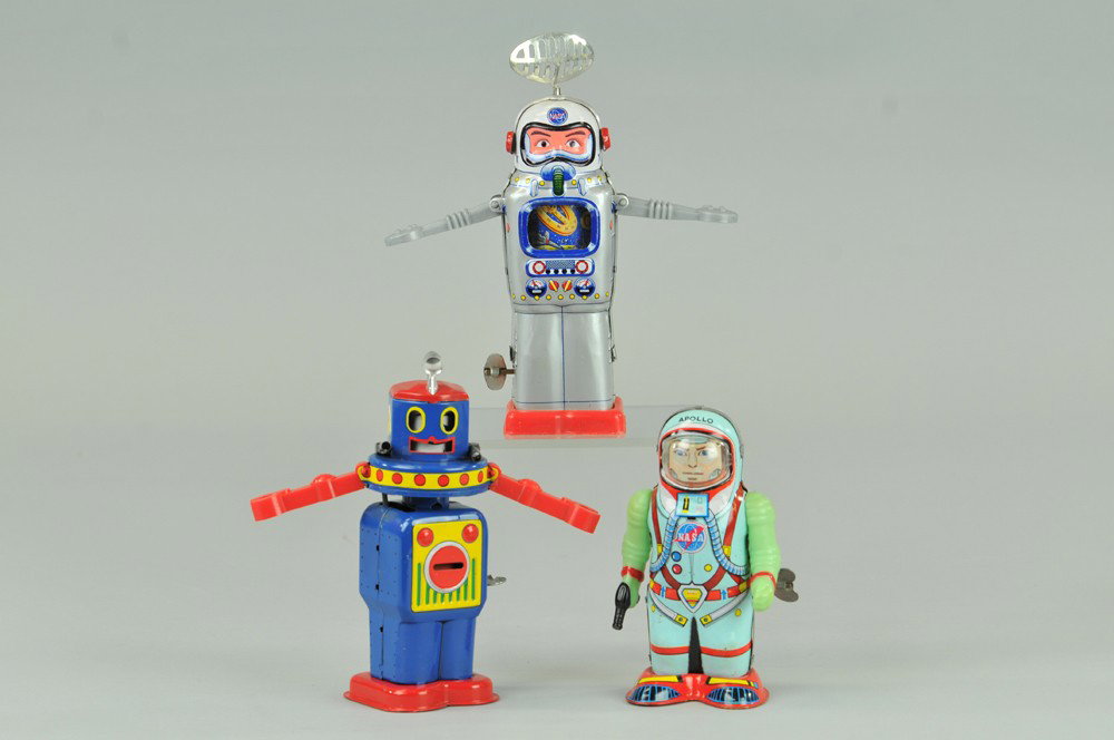 LOT OF THREE ROBOTS: Includes NASA Astronaut with TV screen at chest, Apollo Astronaut, and Atomic Robot, very colorful overall, turns head while he walks. 5 1/4" - 7 1/2" h. Overall, (Exc. Cond.) Inv# 0084 0084 5 1/4" - 