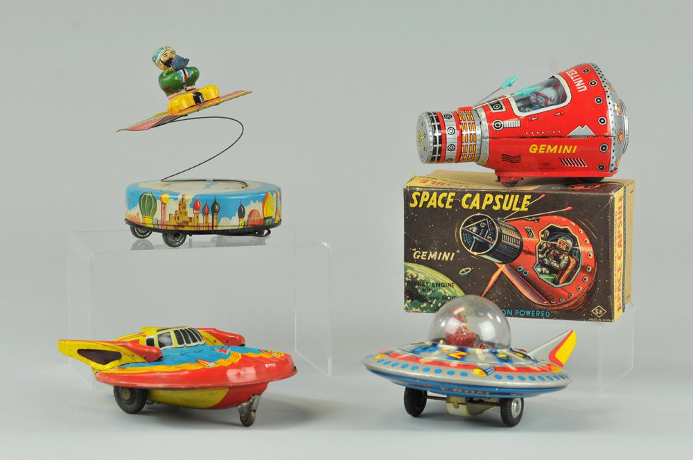 ALI AND THE FLYING CARPET AND SPACE TOYS: Lot includes; Terra Mars Saucer, 10-2 Saucer, United States Gemini Capsule, and Ali with original rubber lantern. Approx. 6" - 6 1/2" diam. Overall; (VG Cond.) Inv# 0187 0187 0187 Approx. 6" - 6 1/2" 