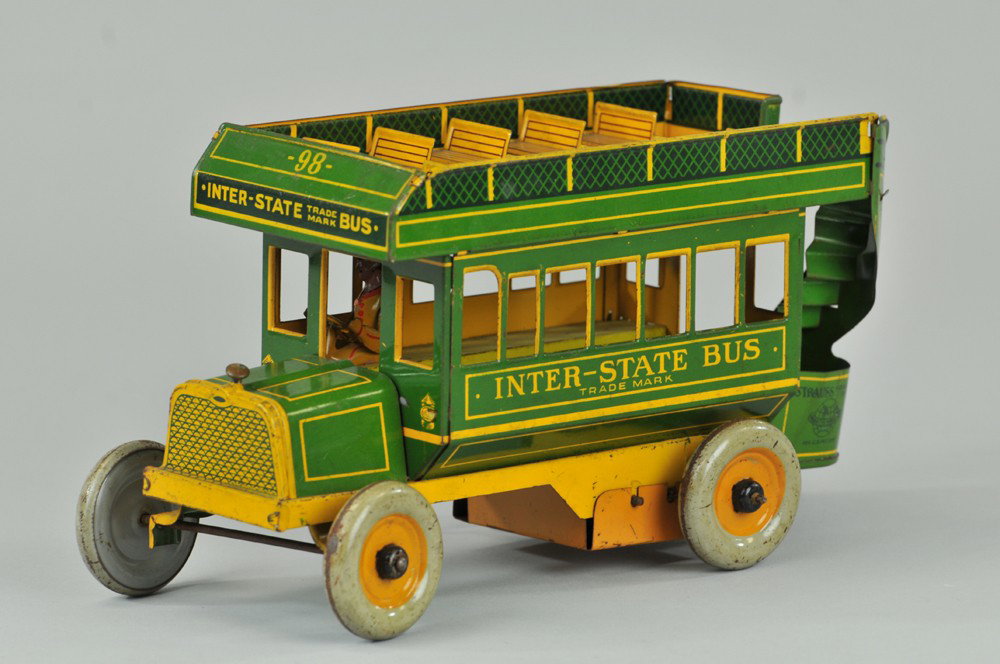 STRAUSS INTER-STATE BUS: Lithographed tin, green & yellow version, upper deck seating, full rear stairs, key wind operated, seated driver. 10 1/2" l. Working sluggishly, (VG Cond.) 10 1/2" l.