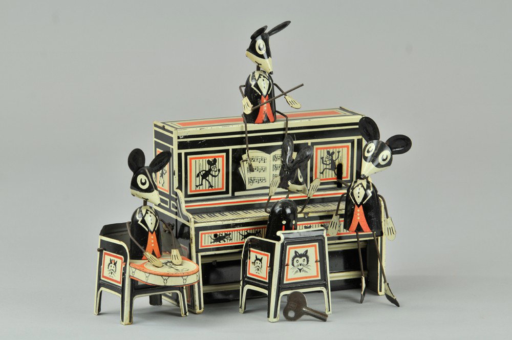 MERRY MAKERS BAND: Louis Marx, c. 1929, classic four piece band toy, often referred to as the Mickey Band Toy: clockwork driven mouse band features three musicians & conductor seated on piano, great wind-up action. 9 1/
