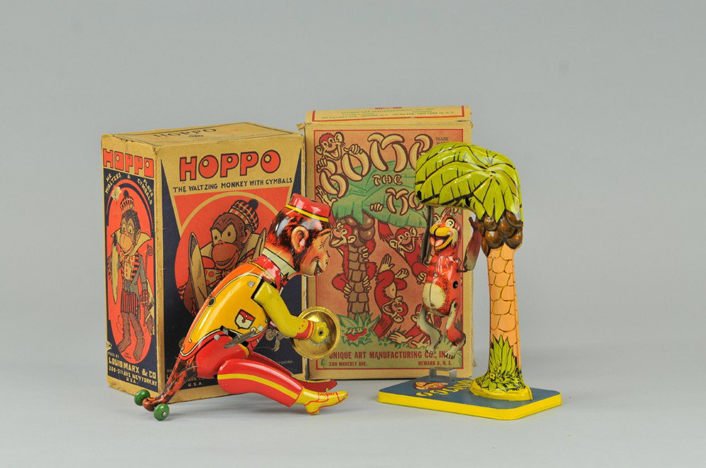 LOT OF TWO MONKEY TOYS: Both boxed, includes Marx "Hoppo" the waltzing monkey with cymbals & Unique Art "Bombo The Monkey" on tree, both key wind operated. 9 1/2" h. Box missing flaps, one heavily repaired, toy (Exc. Cond.) 