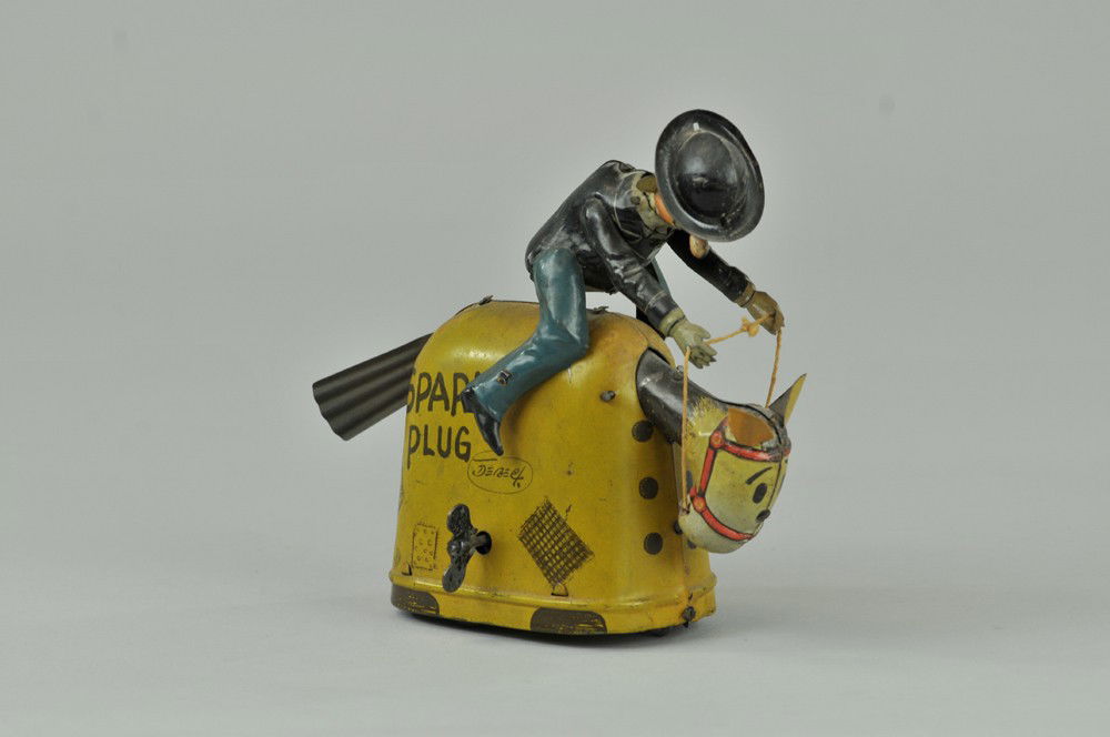 BARNEY GOOGLE RIDING SPARKPLUG: Fischer, Germany, lithographed tin, familiar comic pair depicted in riding toy with clockwork action creating very aggressive galloping motion, rear of jacket is hand painted. 7" l. (VG Cond.) 7" l.