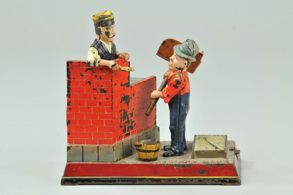MASON MECHANICAL BANK: Shepard Hardware Co., designed by Charles G. Shepard & Peter Adams, patented 2/8/1887. The comical appearing Hod Carrier receives the coin and throws it forward, depositing it in the bank. The mason r