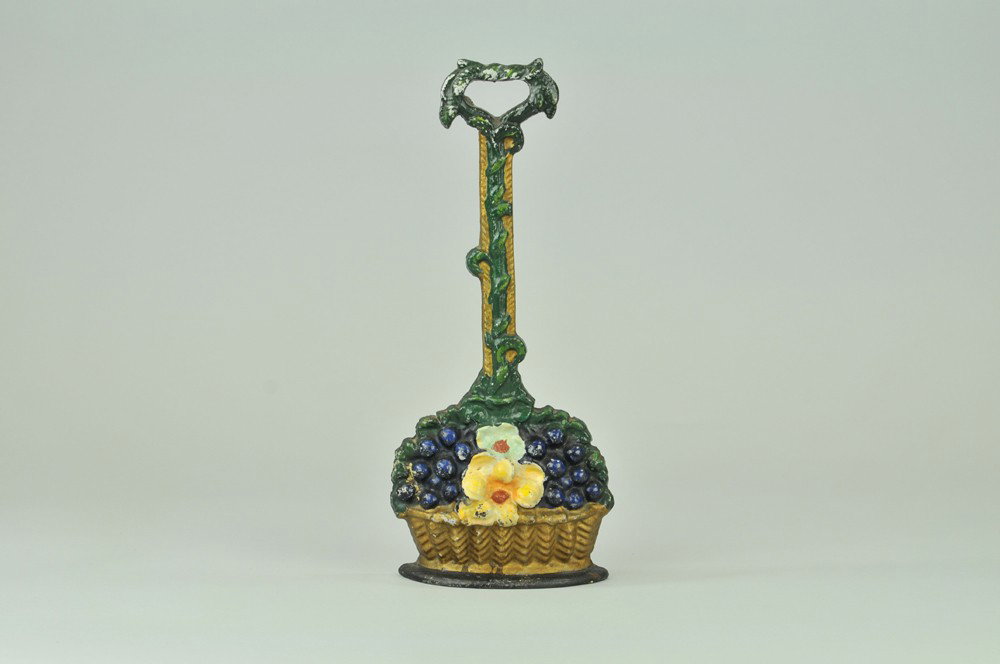 DOGWOOD FLOWER WITH BERRIES DOORSTOP: BOOK EXAMPLE, clever design of wicker basket with brightly colored dogwood flowers, berries, and climbing vine trellis forming handle. 12 1/4" x 6". (Pristine Cond.) 12 1/4" x 6".