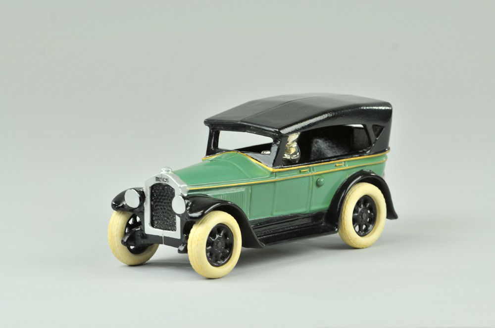 CONTEMPORARY ARCADE BUICK COUPE: Painted cast iron, version of Arcade Buick by Don Lewis and numbered 30, great mold design, colors done in classic teal green and black, rubber tires, includes original box. 8 1/4"l. (Mint Cond.) 8 1/