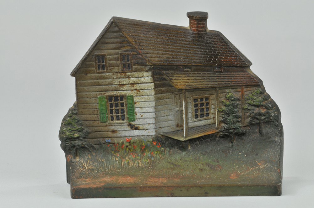 EDGAR ALLEN POE CABIN DOORSTOP: Marked "B&H", Bradley & Hubbard, cast iron, excellent detailed casting, depicts American Master of the Macabre's birthplace, very desirable, rare. 5 7/8" x 7 7/8". (Exc.-Pristine Cond.) 5 7/8" x 7 7/8
