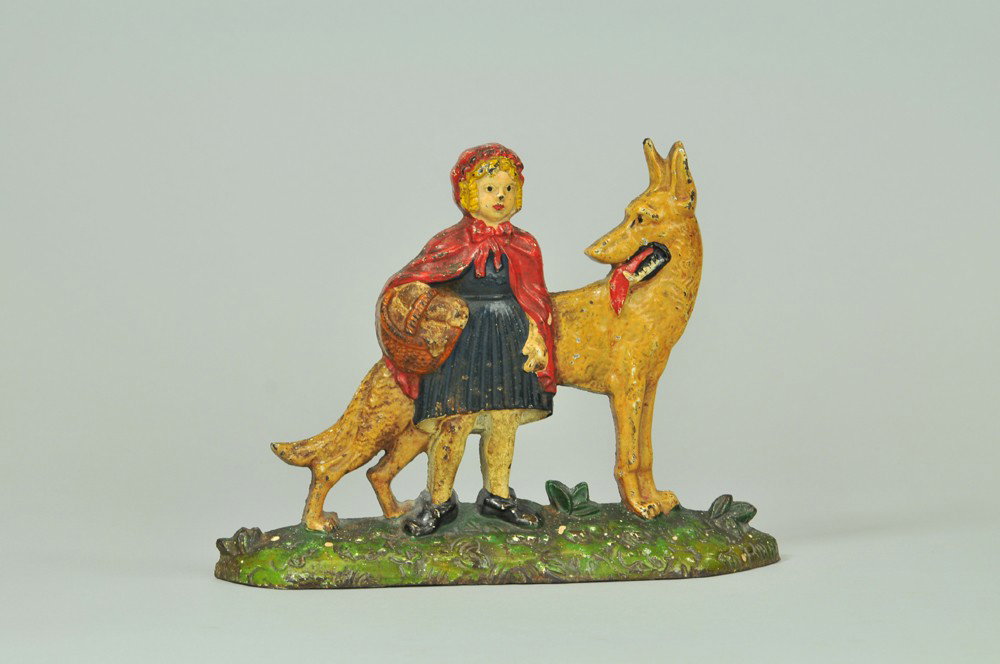 LITTLE RED RIDING HOOD & WOLF DOORSTOP: Embossed "Little Red Riding Hood" on reverse, colorful item, popular nursery theme, great overall casting details. 7 1/2" x 9 3/4". (Exc. Cond.) 7 1/2" x 9 3/4".