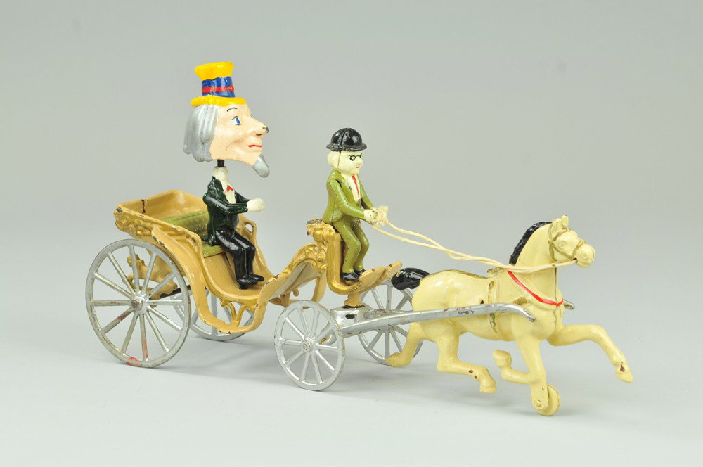 KENTON UNCLE SAM NODDING TOY: Sold by SEARS, cast iron, colorfully painted overall, depicts Foxy Grandpa driving Uncle Sam in open carriage, spoke wheels, drawn by solo white horse. 17" l. (Exc. Cond.) 17" l.