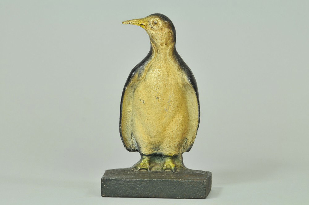 PENGUIN DOORSTOP: Depicts cast iron standing penguin on base with head turned, very unusual, rare. 7 3/4" X 4 3/8". (Pristine Cond.) 7 3/4" X 4 3/8".