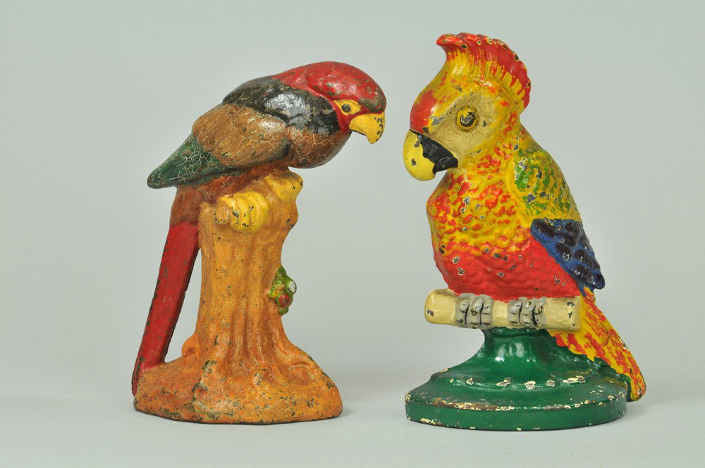 LOT OF TWO BIRD DOORSTOPS: Includes cast iron Hubley "Polly" cockatoo in bright, colorful paint and National Foundry, cast iron Parrot on Stump. 7 1/2"-8 1/2" h. (Exc.-Pristine Cond.) Inv# #0443 7 1/2"-8 1/2" h.